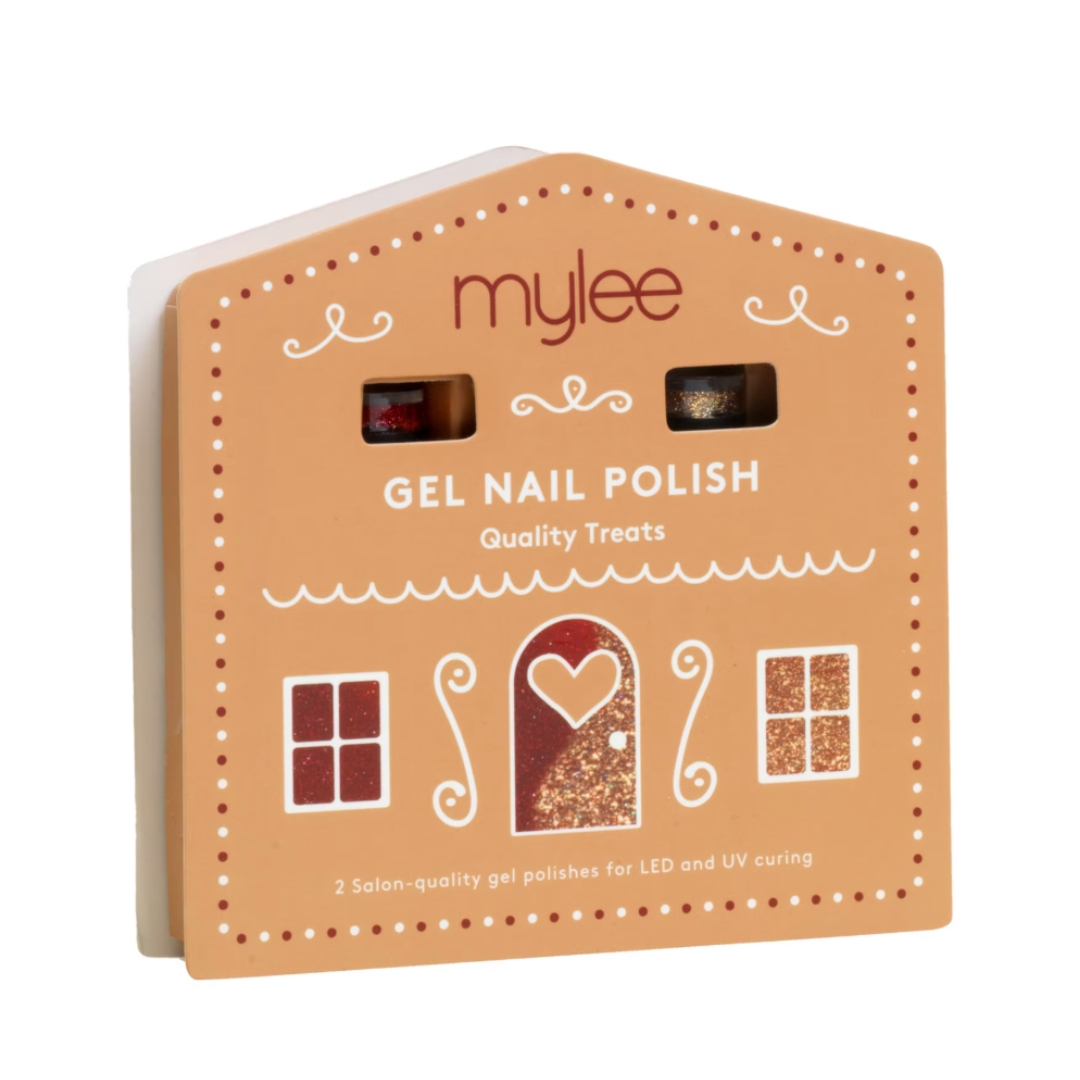 A product shot of the Mylee Quality Treats Duo set, which features a sparkly gold and red gel nail polish duo, packaged in a gingerbread house-style box, and pictured on a white background