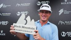 Michael 'MJ' Maguire holding up the 2024 Black Mountain Championship trophy