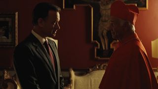 Tom Hanks, as Robert Langdon, stands before a cardinal in the Vatican in Angels & Demons
