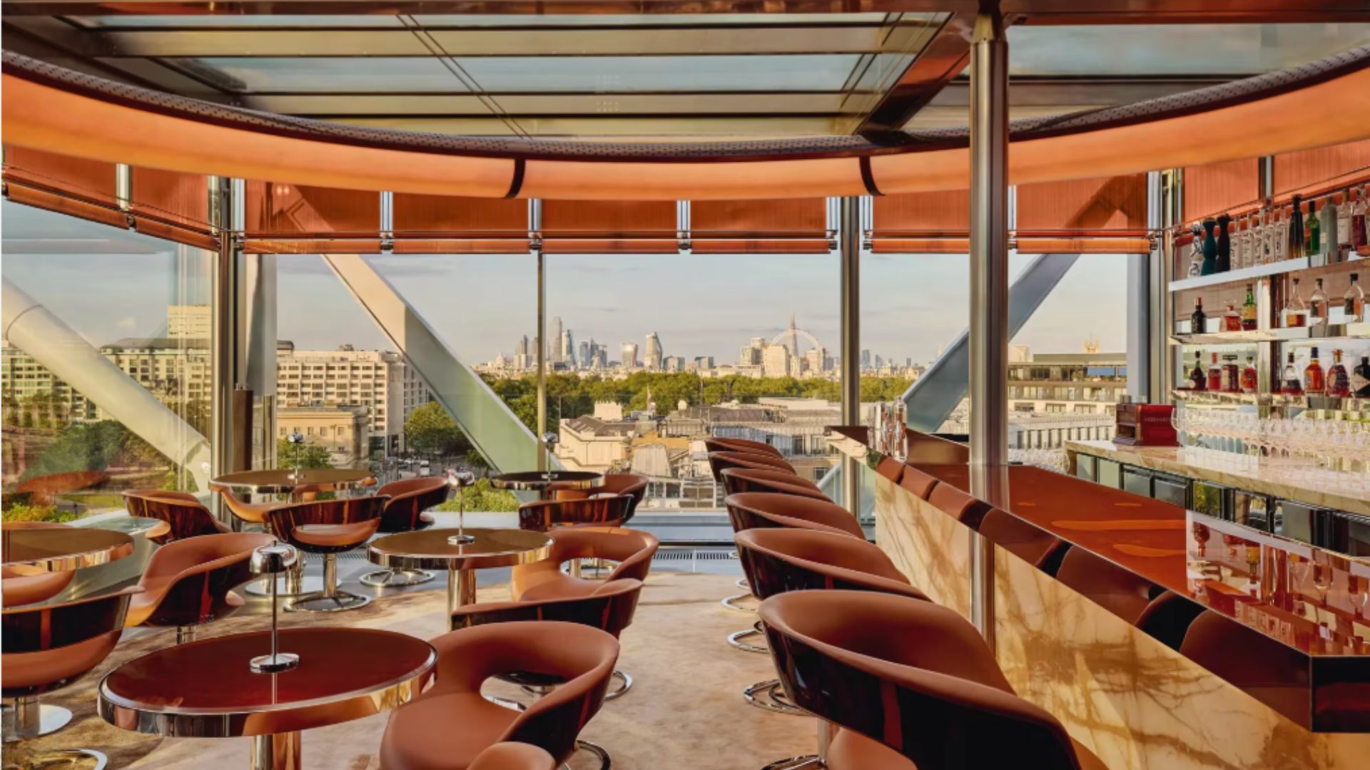 an image of the interiors at the rooftop bar at The Emory, showing sweeping skyline views of the city