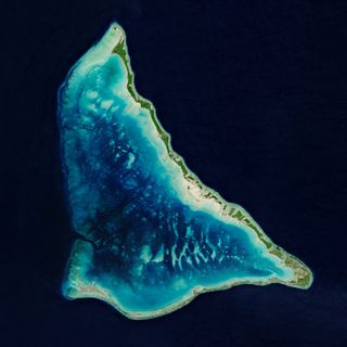 The Tarawa Atoll, a remote Pacific nation in the Republic of Kiribati, can be seen from space in this image captured by the Copernicus Sentinel-2 mission. Kiribati is an independent island nation spreading out 1351357 square miles (3.5 million square kilometers) of the ocean with a total land area of just 309 sq miles (800 sq km).