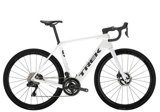 A white carbon fibre frame electric bike with integrated battery