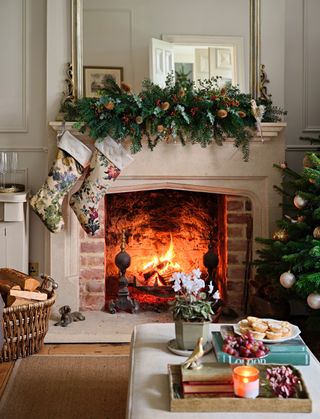 Fireplace with a Christmas mantel garland and stockings