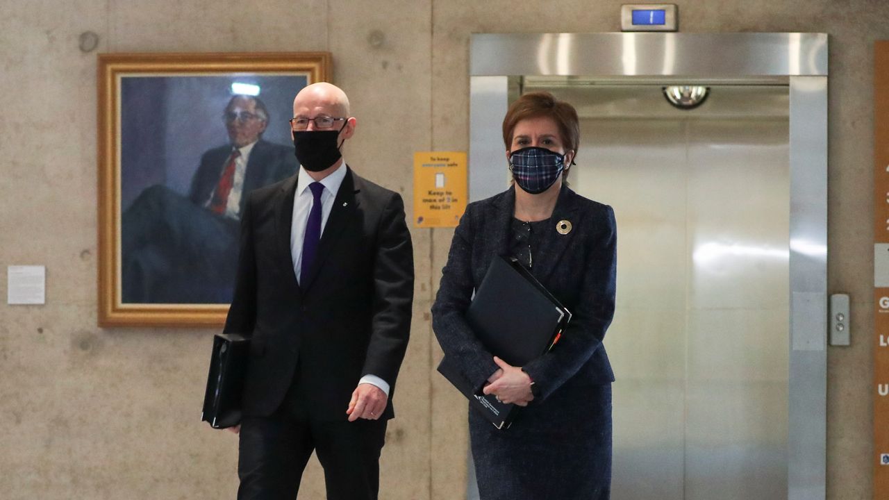 Deputy First Minister John Swinney arrives in Holyrood with Nicola Sturgeon