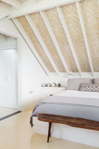 coastal bedroom with painted floors