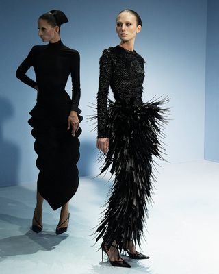 Two models on Jean Paul Gaultier runway in dresses