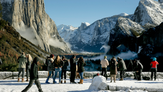 Visitors enjoy the Tunnel View overlook in Yosemite National Park