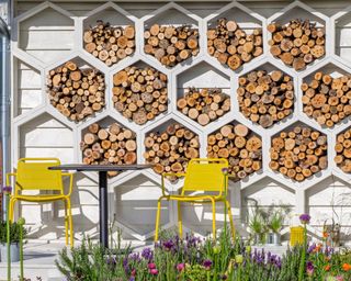 A garden building with honeycomb design including an insect hotel