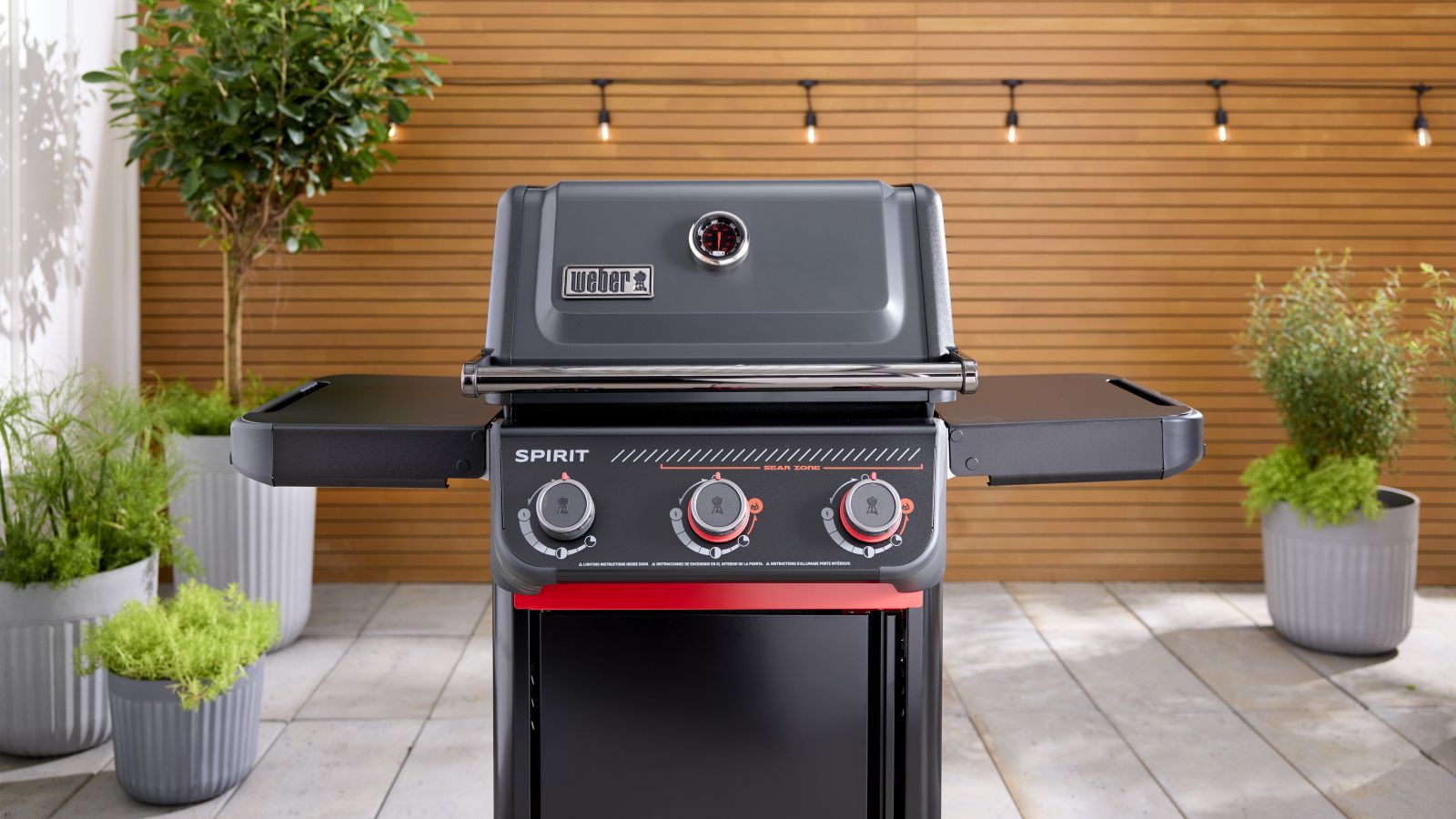 Weber Spirit E325 Stealth in backyard