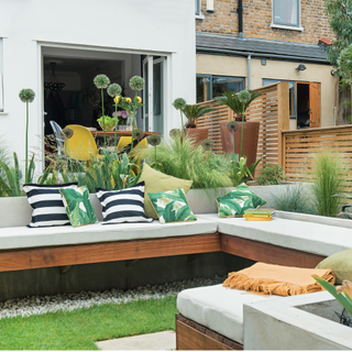 yellow chair with cushion and green lawn