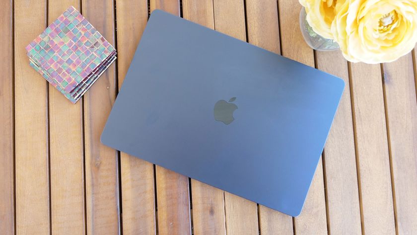 MacBook Air 15 M3 lid closed on a slatted wooden table