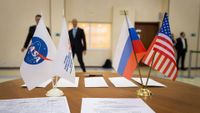 The flags of the United States, Russia, Roscosmos and NASA are displayed among astronaut an cosmonaut training documents in Star City, Russia.