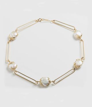 Pearls nestled inside gold links
