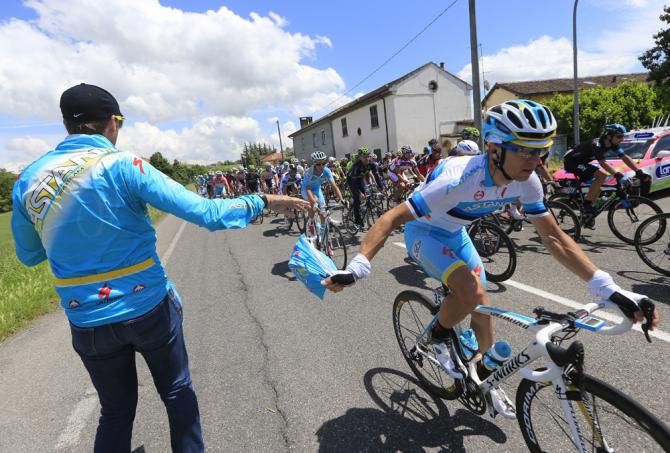Tanel Kangert (Astana) rides through the feedzone
