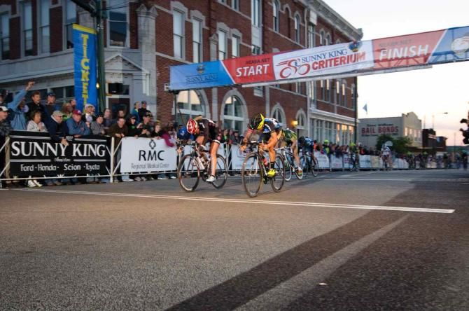 Corin Rivera (Marian University) throws her bike to the line to capture the win at Sunny King