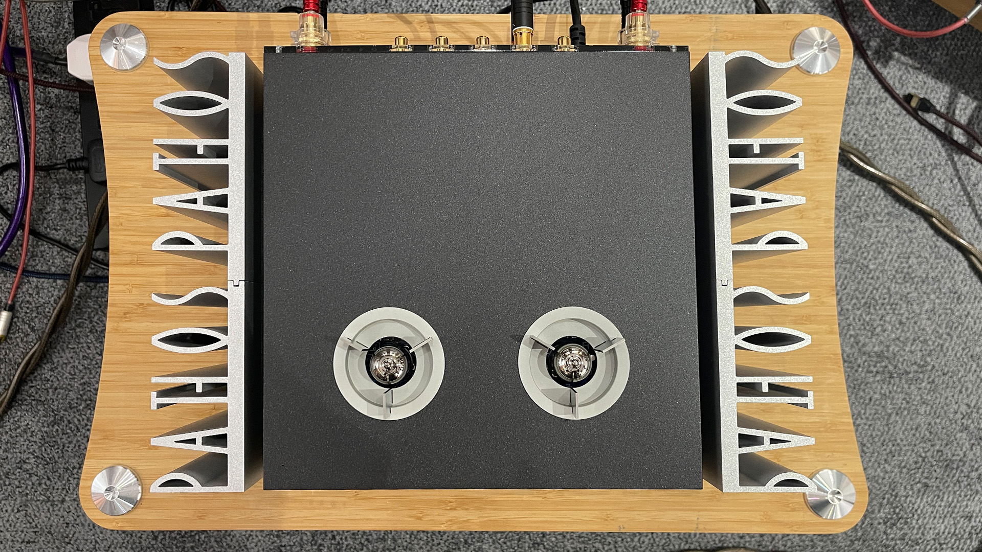 Pathos Inpol Remix MkII integrated amplifier on wooden hi-fi rack, top down view showing valves