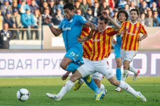 Alania Vladikavkaz defenders try to stop Zenit's Hulk in a Russian Premier League game in 2013.