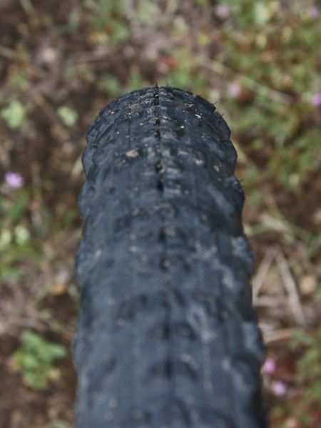 The perfectly rounded tread profile puts the bare minimum amount of rubber on the ground but provides virtually no shoulder to lean on in corners.