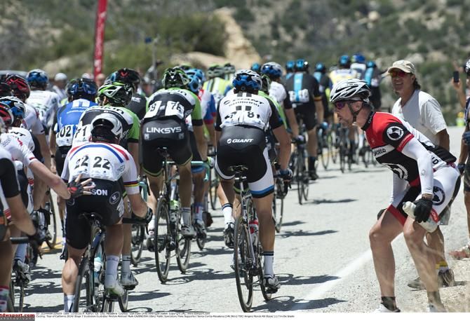 Mark Cavendish (Omega Pharma-QuickStep) gets support from his teammates during Stage 7