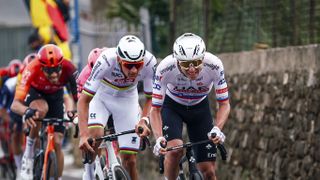 SANREMO, ITALY - MARCH 16: (L-R) Mathieu van der Poel of The Netherlands and Team Alpecin - Deceuninck and Tadej Pogacar of Slovenia and UAE Team Emirates attack in the breakaway during the 115th Milano-Sanremo 2024 a 288km, one day race from Pavia to Sanremo / #UCIWT / on March 16, 2024 in Sanremo, Italy. (Photo by Luca Bettini - Pool/Getty Images)