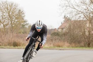 Male cyclist riding in the drops