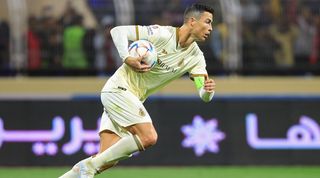 Cristiano Ronaldo runs back to the centre circle after scoring a penalty for Al-Nassr against Al-Fateh, his first goal in the Saudi Pro League.