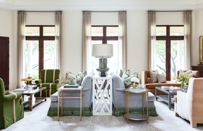 An example of how to design a living room with symmetrical back to back sofas green and blue sofas.