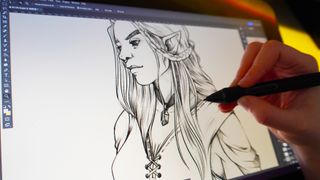 A close up of someone drawing on a screen tablet