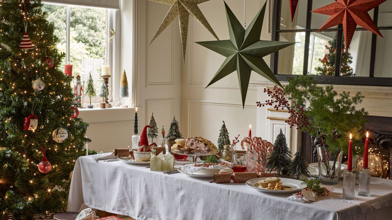 Freiburg pine pre-lit tree (7ft), £369; Baubles from £1.99; Paper stars, £14.99 each; Mikasa crockery, from £6.99; Santa and Nutcracker Christmas glasses (set of 4), £8.99; Gonk mug and bowl set, £14.99