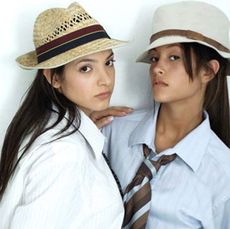 two women with long hair in men's clothing