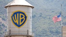 BURBANK, CALIFORNIA - SEPTEMBER 12: An American flag flies at Warner Bros. Studio on September 12, 2025 in Burbank, California. Media giant Paramount Skydance is reportedly preparing a bid to purchase Warner Bros. Discovery, including its movie studio and cable networks. 