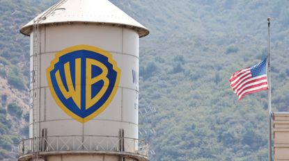 BURBANK, CALIFORNIA - SEPTEMBER 12: An American flag flies at Warner Bros. Studio on September 12, 2025 in Burbank, California. Media giant Paramount Skydance is reportedly preparing a bid to purchase Warner Bros. Discovery, including its movie studio and cable networks. 