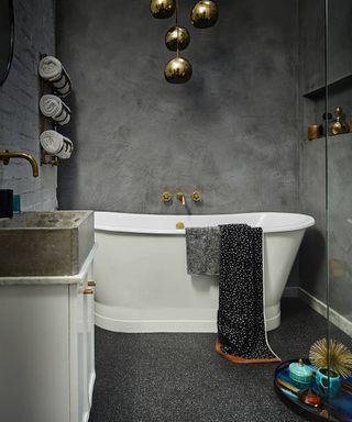 Black bathroom with luxury vinyl tile and concrete effect wall by Carpetright