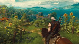 Geralt of Rivia overlooking a town in The Witcher 3 expansion Blood and Wine