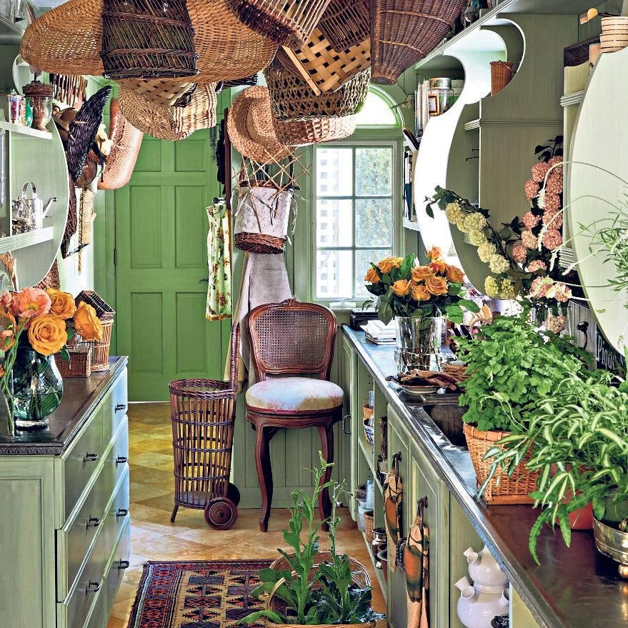 Green flower room with wicker baskets hanging from the ceiling
