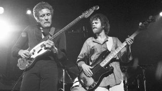 Hamish Stuart and Alan Gorrie of Average White Band performing on stage at Edinburgh, Scotland 1975. Steve Ferrone's debut gig after the death of Robbie McIntosh
