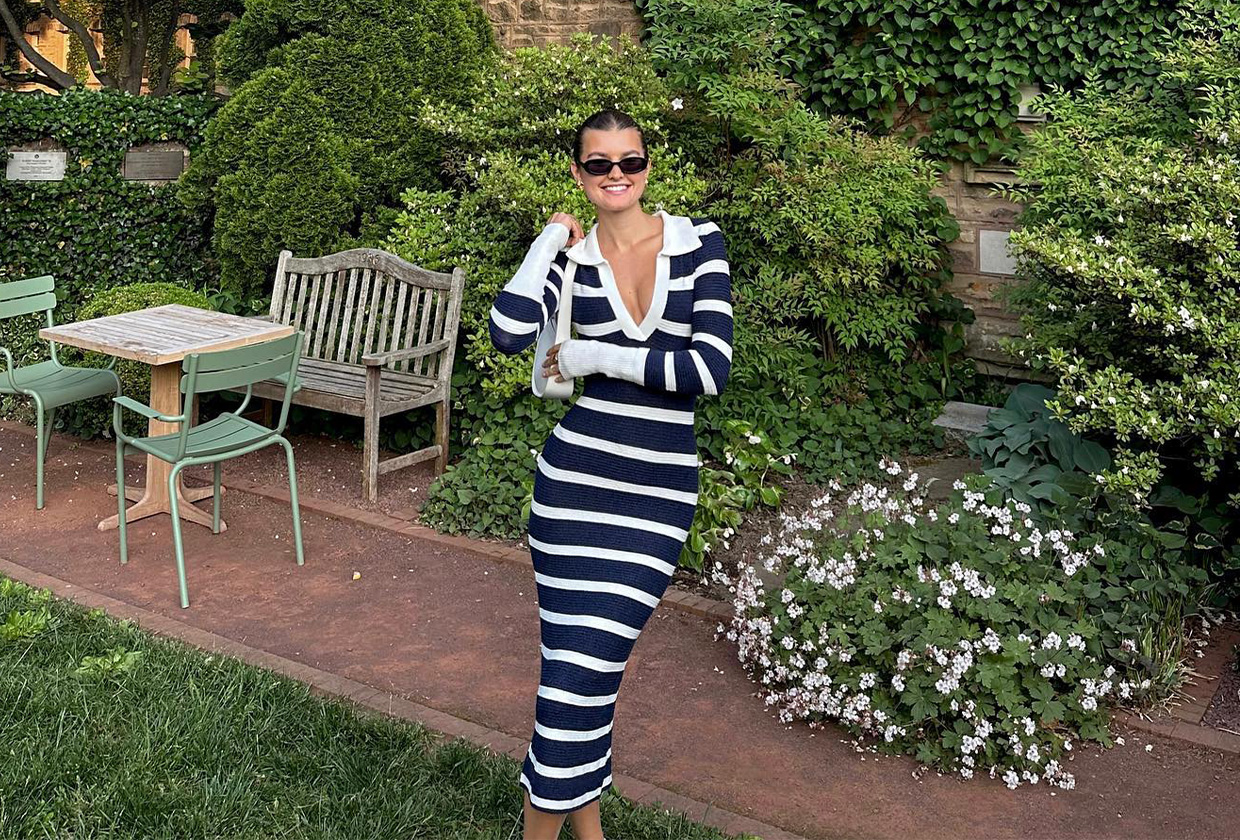 Woman wearing a striped summer dress.