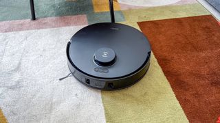 Ecovacs Deebot T30 Omni robot vacuum on a colorful rug