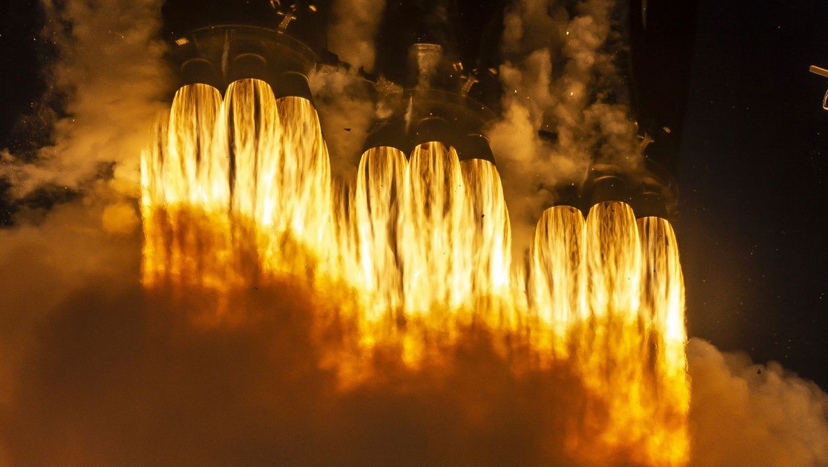 The 27 engines of SpaceX's Falcon Heavy rocket's first stage, nine per booster, launch the massive rocket off Launch Pad 39A at NASA's Kennedy Space Center in Florida on April 11, 2019.