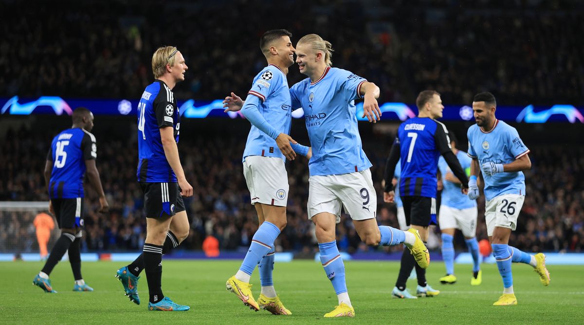 Manchester City&#039;s Erling Haaland celebrates with teammate Joao Cancelo after scoring his team&#039;s first goal in the UEFA Champions League match between Manchester City and FC Copenhagen on 5 October, 2022 at the Etihad Stadium, Manchester, United Kingdom