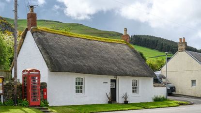 White house with grey thatched roof