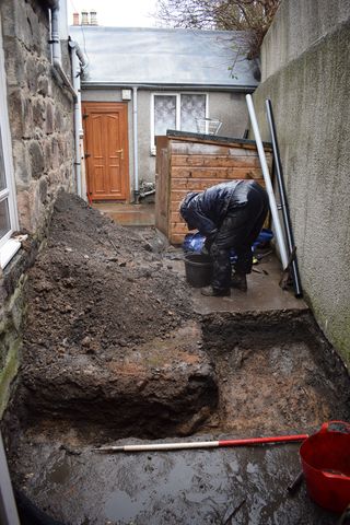 Archaeologists found a total of 115 bone fragments buried in the yard of the 200 year-old house in Aberdeen. Tests show they came from seven individuals and were used after their death for dissections and to practice surgery.