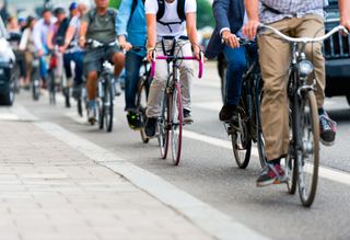 A busy bike lane filled with bike commuters