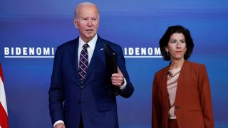 US President Joe Biden pictured with Commerce Secretary Gina Raimondo at an event in the South Court Auditorium in the Eisenhower Executive Office Building at the White House on October 23, 2023 in Washington DC.