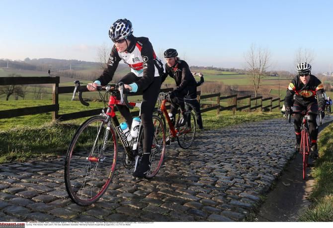 Fans cling on as the Trek Fractory Racing riders hit the front