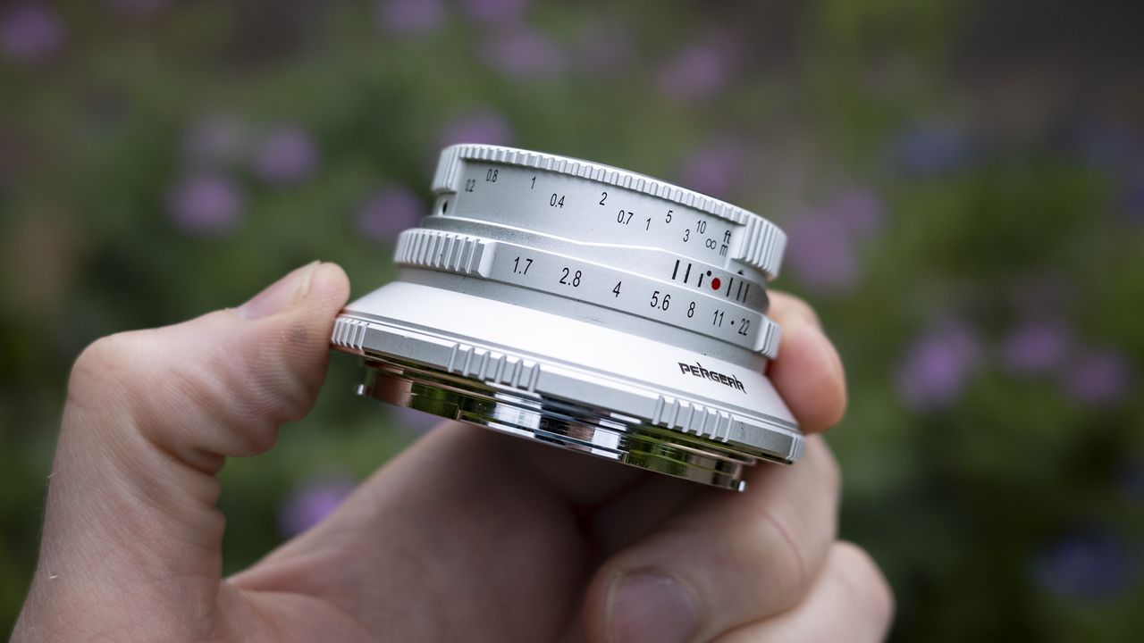 The Pergear 25mm f/1.7 lens in the hand