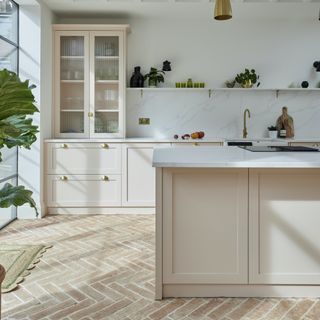 neutral kitchen with terracotta tiled floor