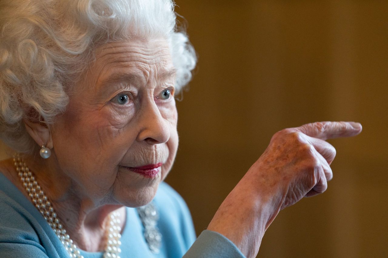 Britain&#039;s Queen Elizabeth II gestures during a reception in the Ballroom of Sandringham House, the Queen&#039;s Norfolk residence on February 5, 2022, as she celebrates the start of the Platinum Jubilee. - Queen Elizabeth II on Sunday will became the first British monarch to reign for seven decades, in a bittersweet landmark as she also marked the 70th anniversary of her father&#039;s death. (Photo by Joe Giddens / POOL / AFP) (Photo by JOE GIDDENS/POOL/AFP via Getty Images)