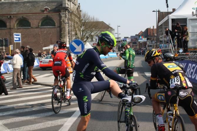Alex Dowsett uses his bike to help him stretch