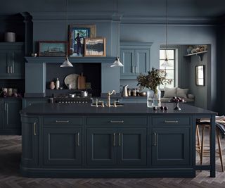 dark indigo blue kitchen with walls also painted in dark blue